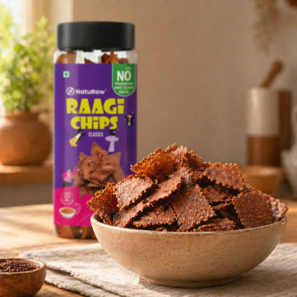 Naturaw Ragi Chips Classic served in bowl with product jar in background on kitchen table